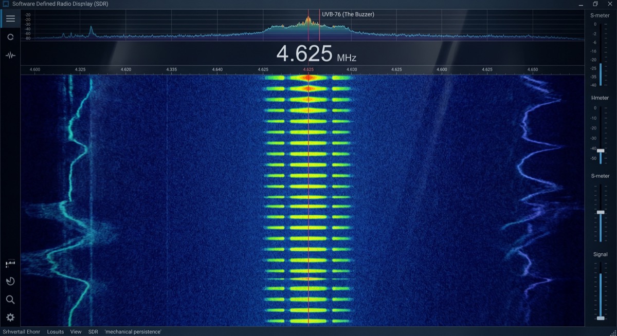 The waterfall at 4.625 MHz: a column of yellow-green dashes firing periodically in the blue void, the buzzer doing exactly what it has done for fifty years